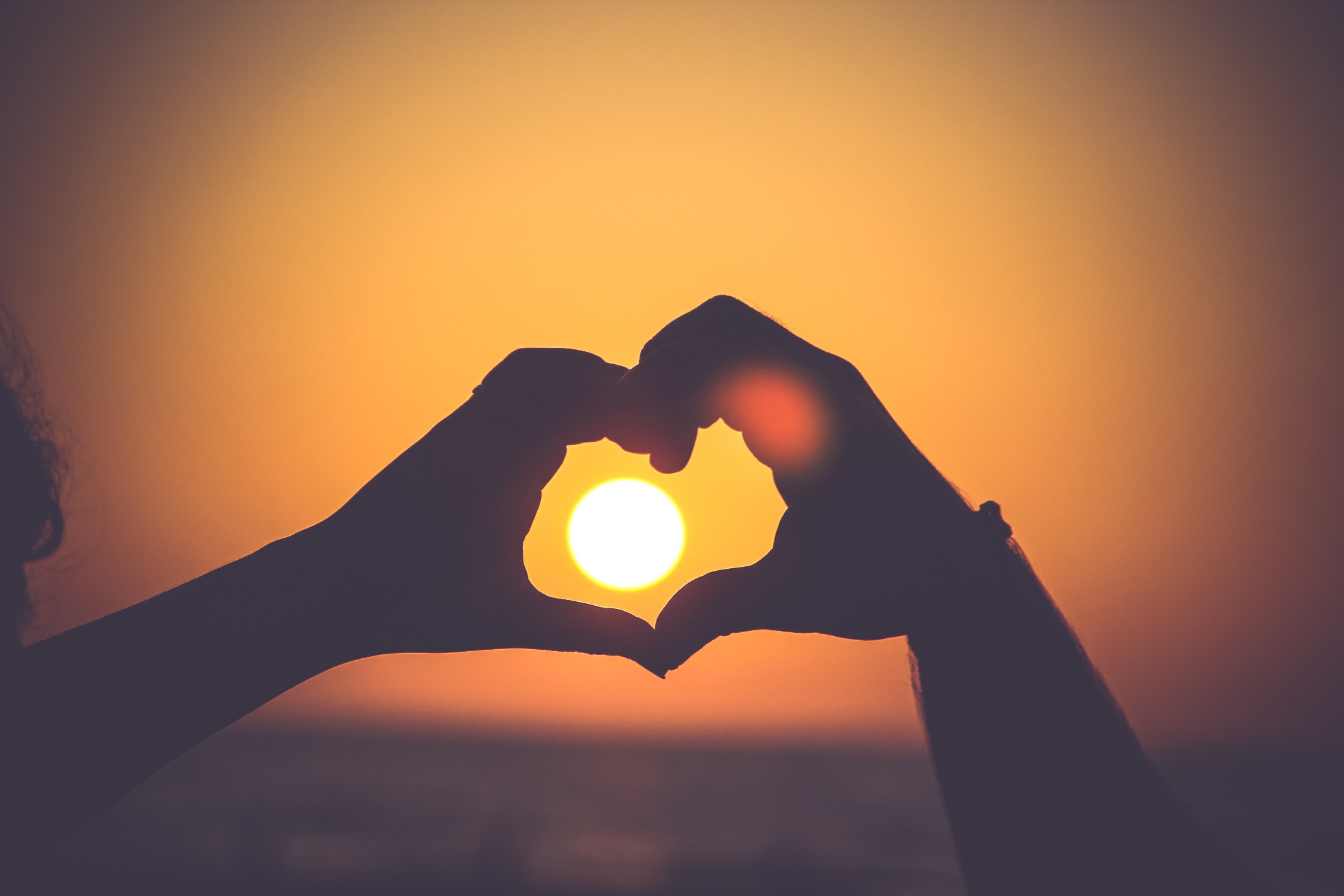 hand heart sunset
