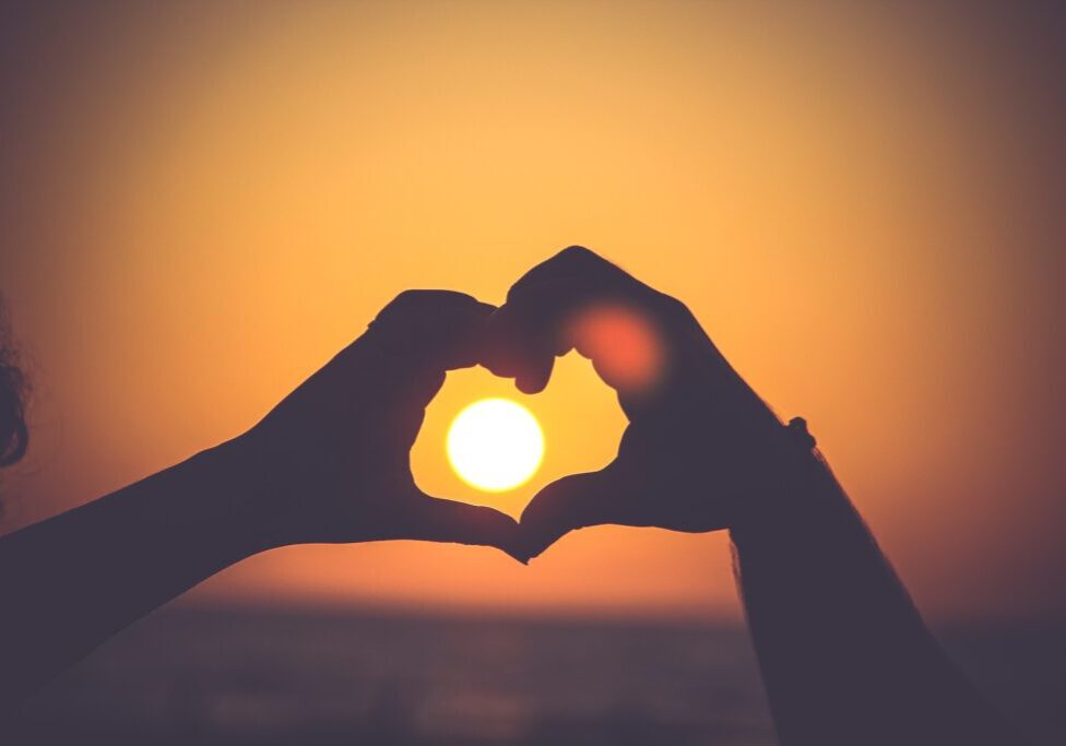 hand heart sunset
